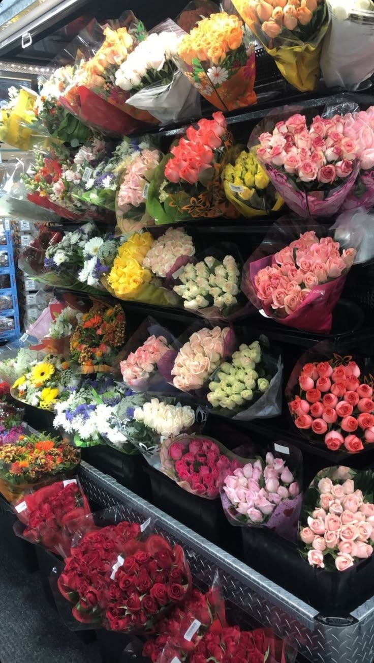 Vibrant fresh flower stems being arranged at the counter
